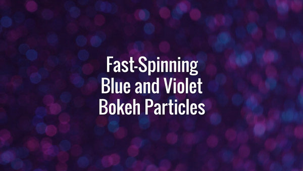 Seamlessly looping rotating flickering blue and violet glitter particles on dark surface.