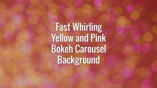 Seamlessly looping rotating flickering yellow and pink glitter particles carousel.