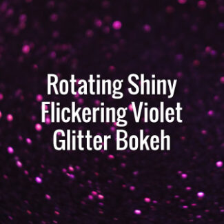 Seamlessly looping spinning flickering violet glitter particles on dark surface.