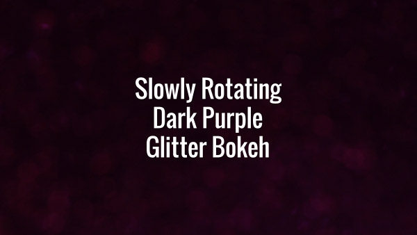 Seamlessly looping rotating dark violet bokeh.