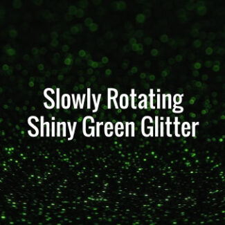 Seamlessly looping slowly spinning shiny green glitter particles on dark surface.