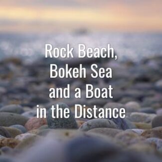 Beach full of stones and distant defocused boats with sea bokeh. Stock Footage.