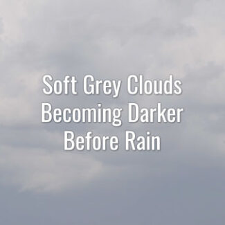 Time-lapse video of overcast sky. Gray floating clouds getting darker foreshadowing heavy rain.