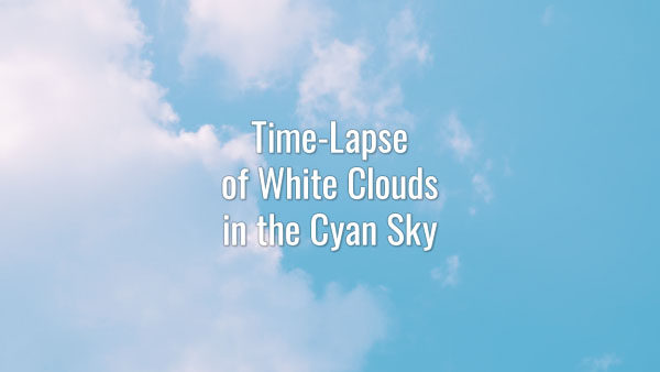 Time-lapse video of white clouds in the cyan sky on a summer day